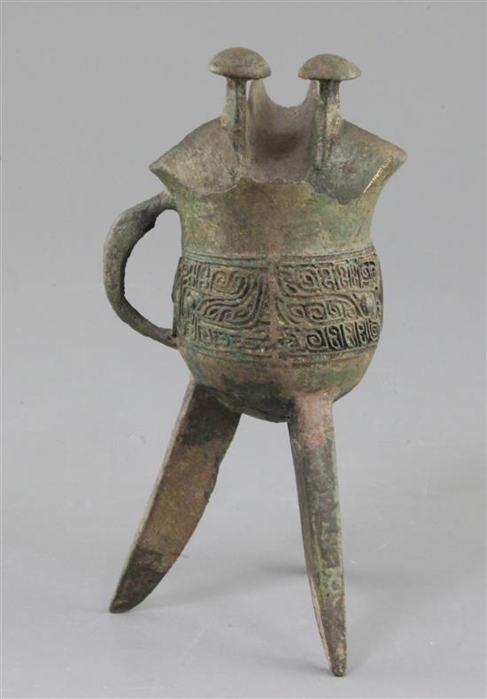 A Chinese archaic bronze tripod ritual wine vessel, Jue, Shang dynasty, 13th-12th century B.C., Anyang, 17cm high, large losses to rim